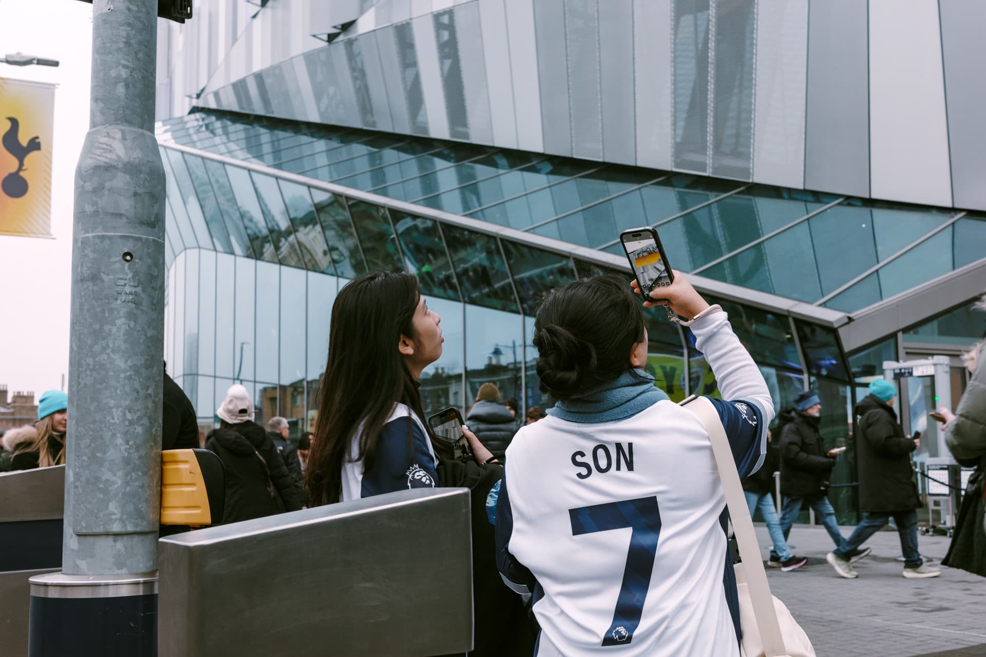 Fans taking a photo outside the stadium